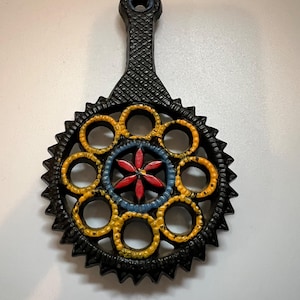 Vintage Round Cast Iron Trivet With Handpainted Floral Design Red Blue Yellow