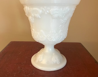 May include: White milk glass pedestal bowl with an embossed grape design.
