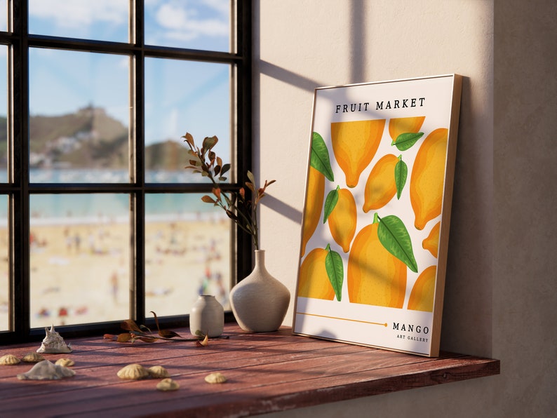 May include: A framed print with a white background and a pattern of yellow lemons and green leaves. The text "FRUIT MARKET" is at the top of the print and "MANGO ART GALLERY" is at the bottom.