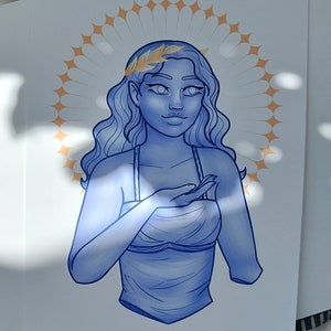 May include: A blue-toned illustration of a woman with long wavy hair, wearing a toga-style top and a laurel wreath. A golden halo surrounds her head. The artwork is on white paper.