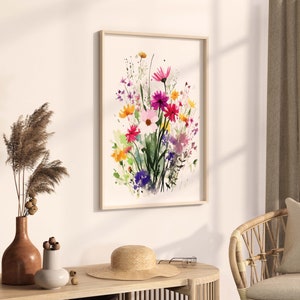 Op de afbeelding: Een ingelijst aquarel schilderij van een boeket roze, paarse en gele bloemen met groene bladeren en stengels. De bloemen zijn in een losse, natuurlijke stijl gerangschikt.