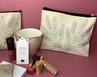 Handprinted fully lined zip pouch/cosmetic bag with lavender print.