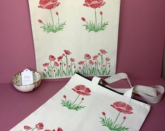 Handprinted canvas zipped tote bag with red poppy design.