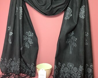 Handprinted black pure cotton scarf with silver flower design.