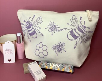 Handprinted organic cotton bee design zipped pouch/toiletry/cosmetic bag.