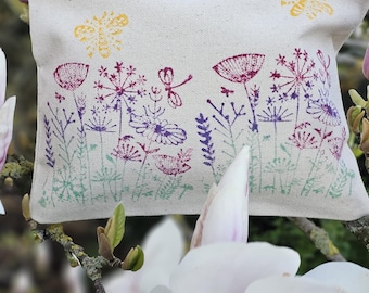 Hand printed fully lined zip pouch with flower meadow design