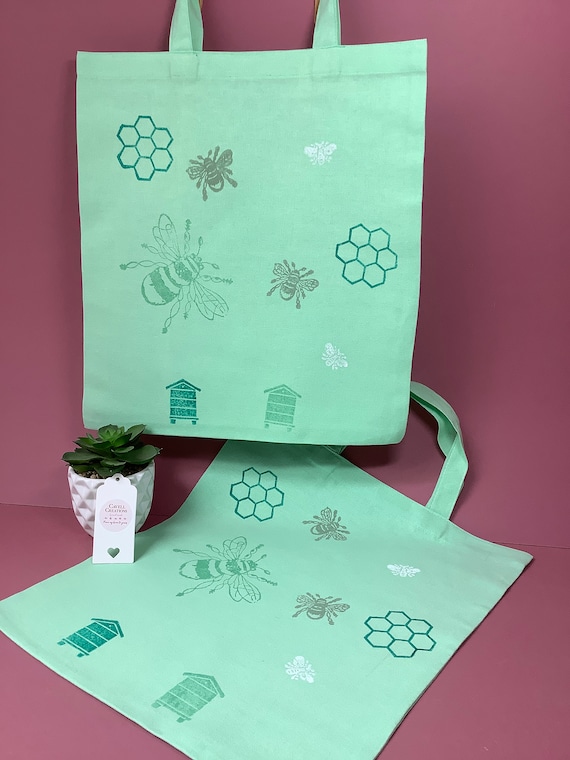 Handprinted cotton pastel colours tote bag with bee design.