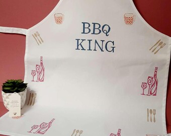 Delantal de algodón estampado a mano con el logotipo de BBQ KING y diseño de vino/cerveza.