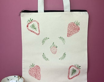 Handprinted canvas zipped tote bag with strawberry design