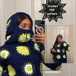 May include: A navy blue crochet hoodie with a hood and a zipper closure. The hoodie is decorated with white, green, and yellow floral patterns. The image also includes the text "Instant Download" and "Crochet PDF pattern".