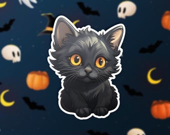 May include: A black kitten with yellow eyes sits against a dark blue background with Halloween-themed patterns like bats, ghosts, pumpkins, and moons.