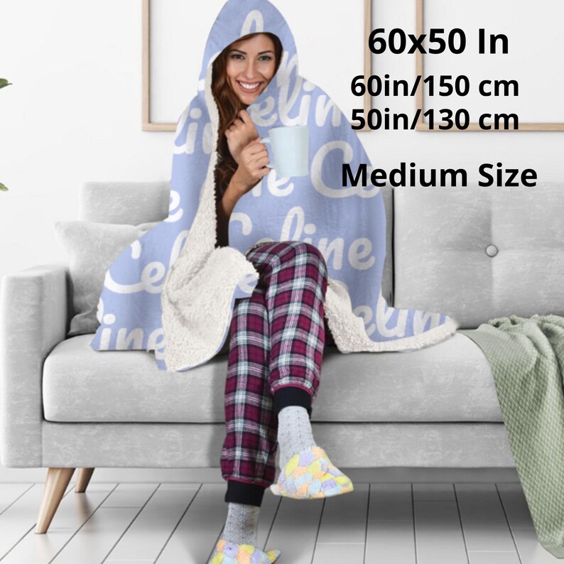 Hooded blue blanket personalised  with your name in a white bold letters.