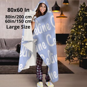 Hooded blue blanket personalised  with your name in a white bold letters.