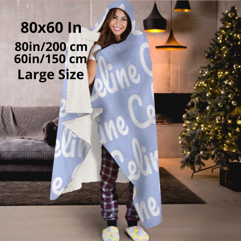 Hooded blue blanket personalised  with your name in a white bold letters.