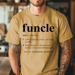 May include: Mustard-colored t-shirt with the word "funcle" in large black letters. Below the word is a definition, including the phrase "Like a regular uncle, just way cooler." The shirt is a casual style.