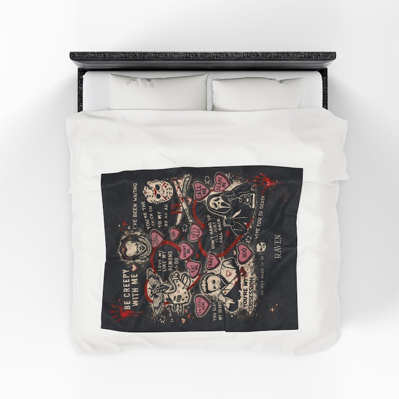 50x60 personalized horror movie blanket folded on a white bed, spooky Valentine throw with creepy romantic sayings and slasher-inspired artwork, custom name black velveteen blanket, gothic gift for horror fans, scary movie lover bedroom decor, medium size cozy throw.