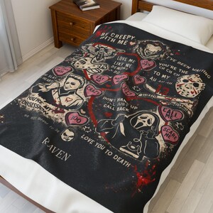 Oversized 60x80 personalized horror blanket displayed on a twin bed, gothic spooky Valentine design with custom name, black velveteen throw covering bed