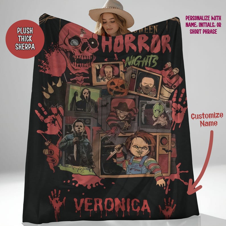 May include: A black fleece blanket with a horror movie theme. The blanket features images of iconic horror movie characters, including Freddy Krueger, Jason Voorhees, Michael Myers, and Chucky. The blanket is personalized with the name "Veronica" in red.