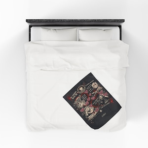 Personalized horror movie blanket folded on a white bed, spooky Valentine throw featuring creepy love sayings and slasher-inspired artwork, custom name black velveteen blanket, gothic gift for horror fans, scary movie lover bedroom decor.