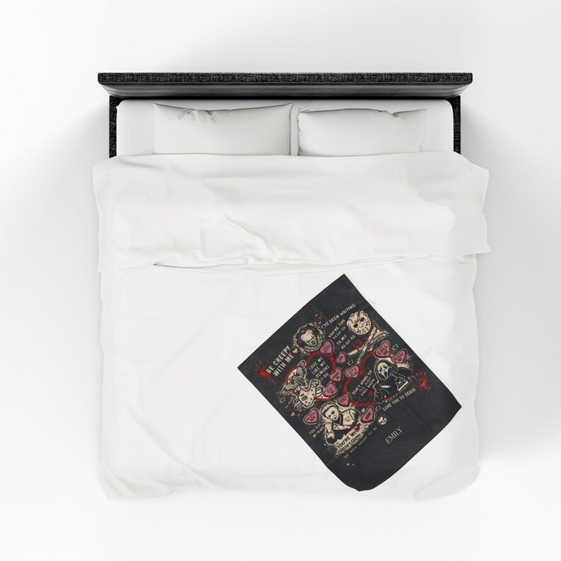 Personalized horror movie blanket folded on a white bed, spooky Valentine throw featuring creepy love sayings and slasher-inspired artwork, custom name black velveteen blanket, gothic gift for horror fans, scary movie lover bedroom decor.