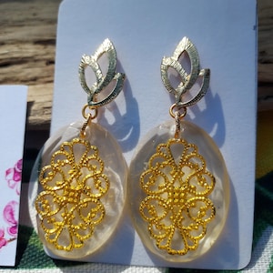 Epoxy resin earrings with a golden oriental-style charm insert. Gift for women. Jewelry for her, handmade jewelry.