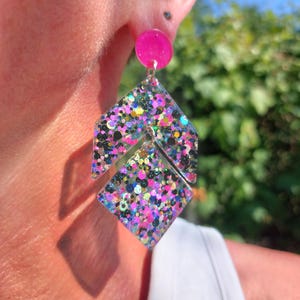 Large resin earrings with multicolored sequins in a geometric shape. Handmade jewelry for women