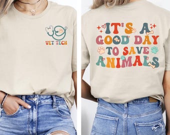 May include: Beige t-shirt with the text "VET TECH" and a stethoscope and paw print design on the front. The back of the shirt says "IT'S A GOOD DAY TO SAVE ANIMALS" in colorful letters with paw prints and bones.