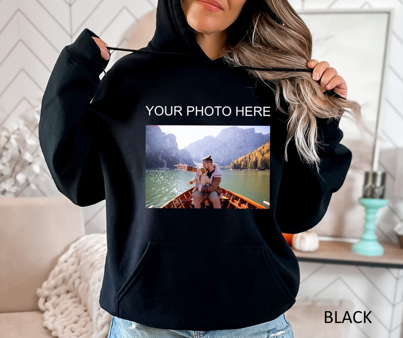 May include: Black hooded sweatshirt with the text "YOUR PHOTO HERE" and a photo of a man and child in a boat on a lake.