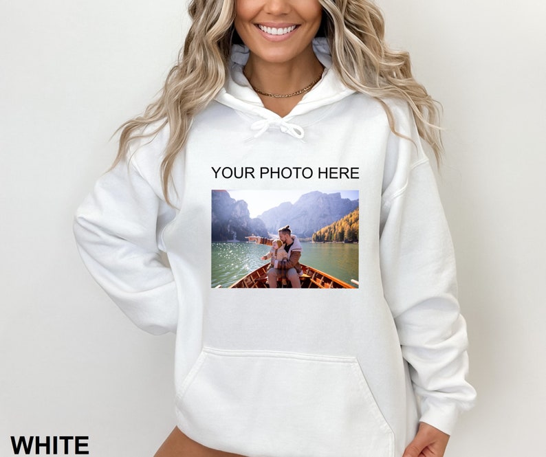 May include: White hooded sweatshirt with a pocket and the text "YOUR PHOTO HERE" printed on the front. The sweatshirt features a photo of a man and a child in a boat on a lake.