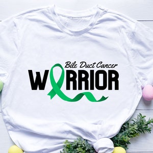 May include: White t-shirt with a green ribbon and the text "Bile Duct Cancer Warrior" in black.