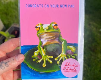 Tarjeta de felicitación por mudanza / Tarjeta de felicitación por cambio de casa, ilustración de una rana dibujada a mano