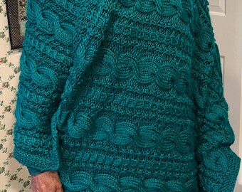 Green cabled lap robe or baby blanket