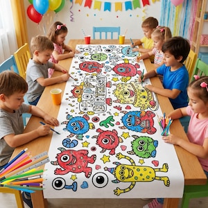 May include: A long white paper table runner featuring black outlines of various monsters and the text Happy Birthday, designed for coloring with markers or crayons. The paper is spread across a wooden table with colorful pencils in the corner.