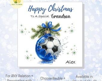 May include: A Christmas card featuring a blue and white football-themed bauble design. The card says "Happy Christmas To A Special Grandson" with the name "Alex" below. Available in standard 15cm x 15cm and large 18cm x 18cm sizes.