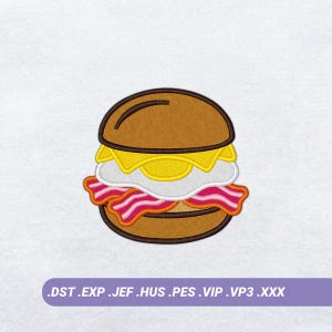 May include: An embroidery design of a breakfast sandwich featuring a brown bun, a yellow fried egg, and pink and white striped bacon. Below the sandwich, a purple banner displays the text: .DST .EXP .JEF .HUS .PES .VIP .VP3 .XXX.