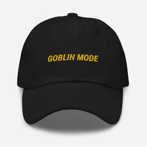 May include: Black dad hat with a yellow embroidered inscription that reads "GOBLIN MODE".
