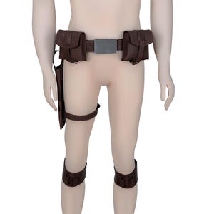 May include: Brown leather belt with two pouches on each side and a silver buckle. The belt is worn on a person's waist. The person is also wearing brown leather leg straps.
