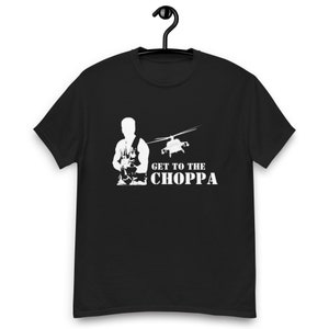 May include: Black t-shirt with a white silhouette of a soldier holding a rifle and a helicopter flying overhead. The text "GET TO THE CHOPPA" is printed below the image.