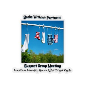 May include: A humorous image of a clothesline with four socks hanging on it. The socks are all different colors and patterns. The text above the socks reads "Socks Without Partners". Below the socks, the text reads "Support Group Meeting. Location: Laundry Room After Dryer Cycle."