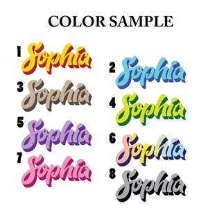 May include: Color samples for the name "Sophia" in eight different colors: yellow, light blue, brown, green, purple, light yellow, pink, and gray.