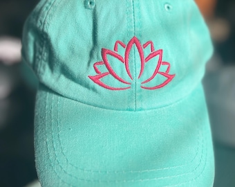 Teal hat with embroidered deep pink lotus blossom