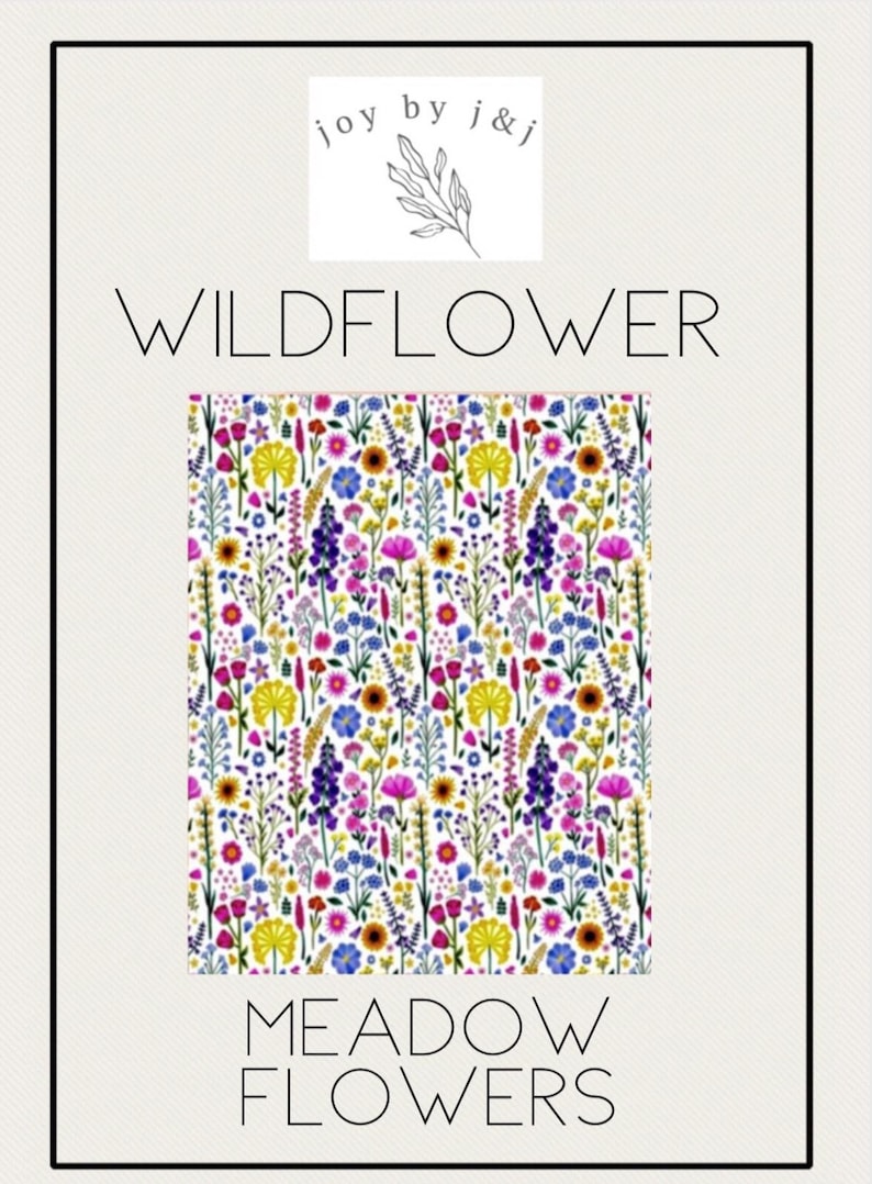May include: A floral pattern featuring a variety of wildflowers in shades of pink, yellow, blue, and purple on a white background. The words "WILDFLOWER" and "MEADOW FLOWERS" are displayed in a minimalist font. The image also includes a logo that says "joy by j&j".