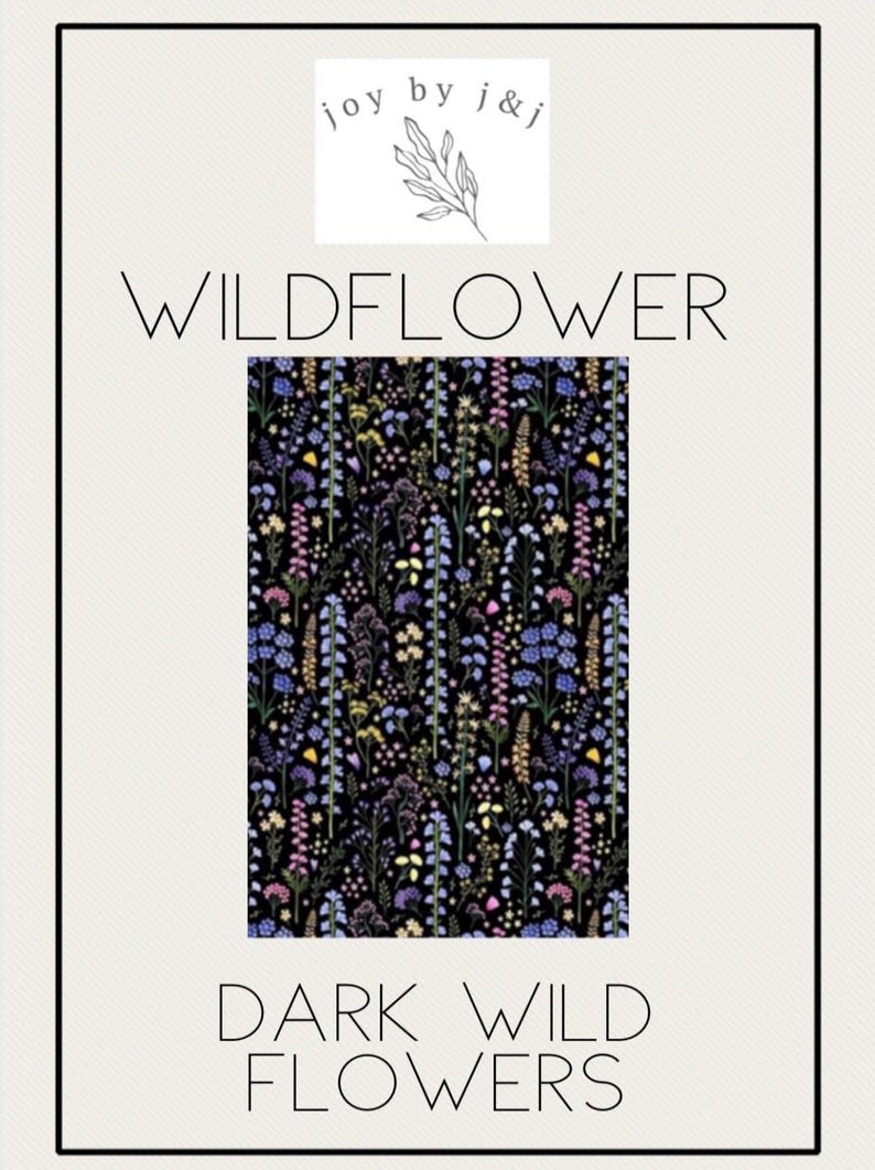 May include: A black background with a floral pattern of wildflowers in shades of purple, blue, yellow, and pink. The text "WILDFLOWER" and "DARK WILD FLOWERS" are displayed in a minimalist font. The logo "joy by j&j" is at the top.