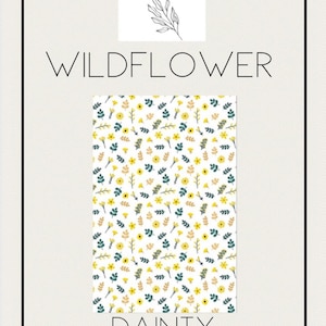 May include: A rectangular pattern with a white background, featuring a repeating design of yellow flowers, green leaves, and brown sprigs. The words "WILDFLOWER" and "DAINTY YELLOW" are displayed in large, elegant fonts. The logo "joy by j&j" is at the top.