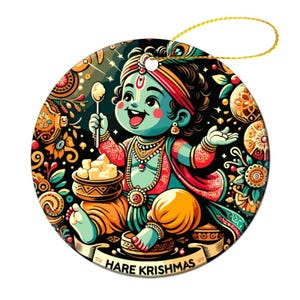 May include: A round Christmas ornament featuring a cartoon illustration of a teal-skinned deity holding a spoon and sweets. The ornament has a gold string for hanging and the text "HARE KRISHMAS" on a banner.