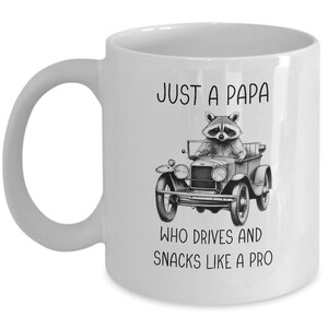 Funny Raccoon Papa Mug: &quot;Drives and Snacks Like A Pro&quot;