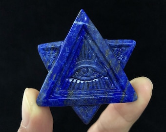 May include: A blue lapis lazuli stone carved into the shape of a Star of David with an all-seeing eye in the centre.