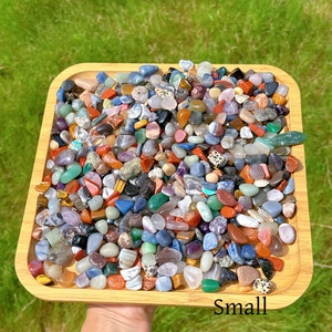 May include: A wooden tray filled with a variety of small, colourful tumbled stones. The stones are a mix of shapes and sizes, and they are arranged in a random pattern. The tray is labelled "Small".