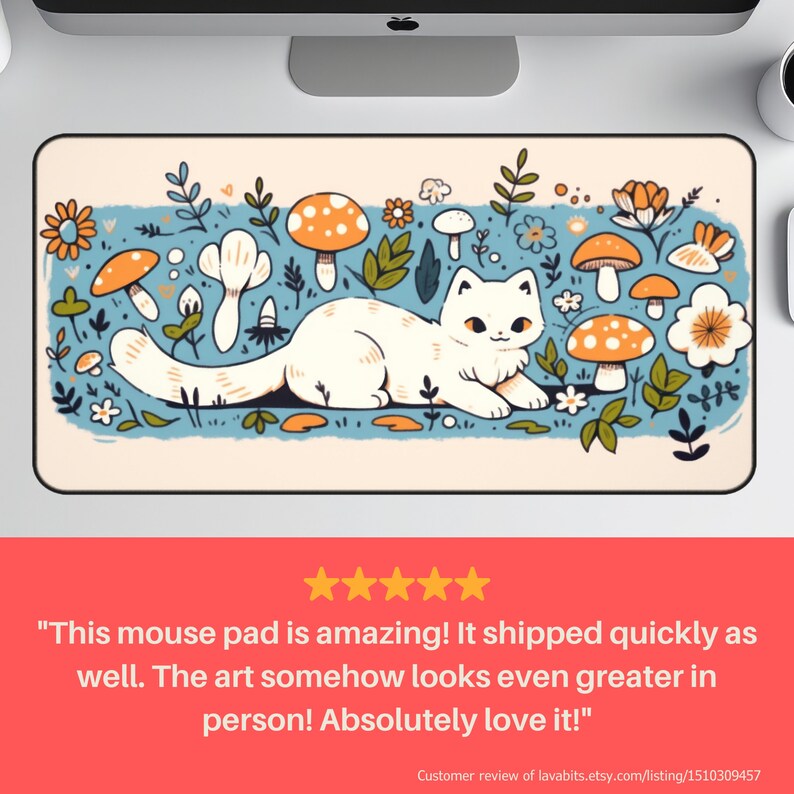 May include: A rectangular mouse pad featuring a white cat lounging amidst orange-capped mushrooms, flowers, and foliage on a light blue background. The design has a whimsical, cartoonish style. The pad has a black border.