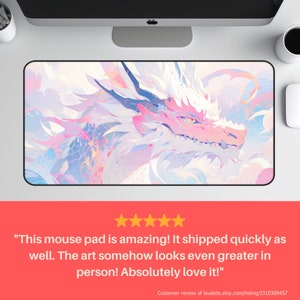 May include: A pink and white dragon mouse pad with a detailed illustration of the dragon's face. The mouse pad has a soft, smooth surface and is perfect for gaming or everyday use.